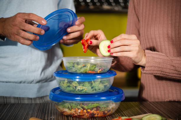 istock Unrecognizable couple preparing their vegan lunch to go 1434663857
