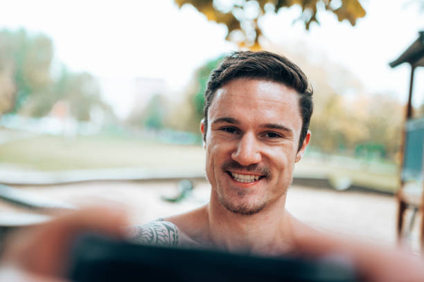 istock muscle man take a selfie outdoor 1434663930