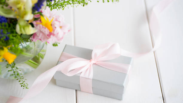 istock Box with a gift and a bouquet of flowers 1434668748