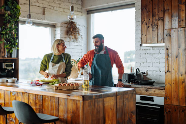 istock Happy Caucasian couple cooking together. 1434671049
