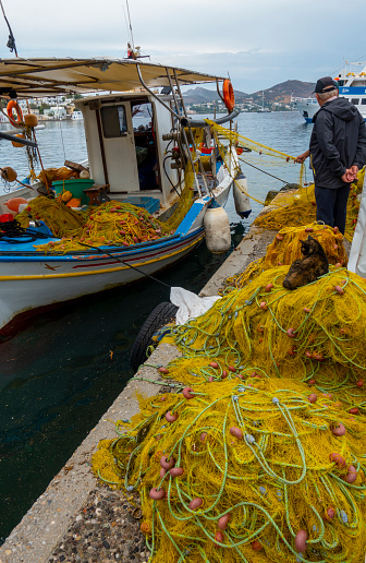 Leros Island, Greece, August 24, 2022; Fisherman boat and net in The harbor of Agia Marina, Leros island