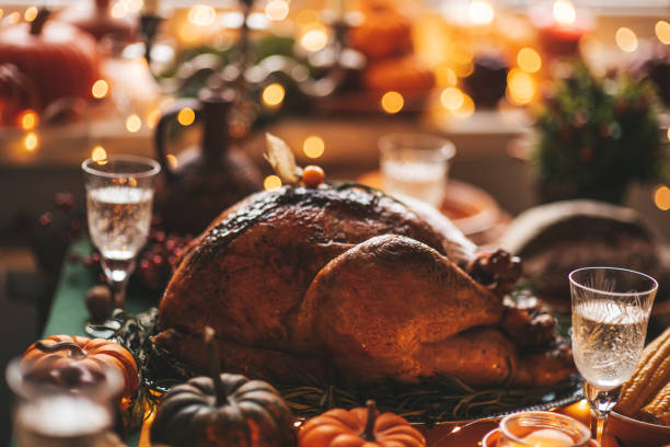 istock Thanksgiving holiday dinner table setting with fall decoration and pumpkins 1434672615