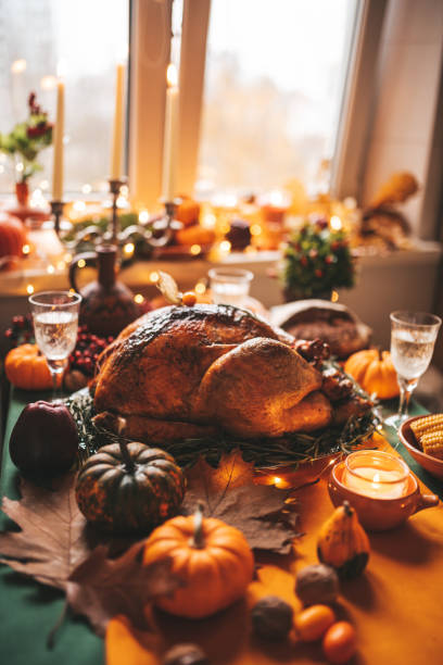 istock Thanksgiving holiday dinner table setting with fall decoration and pumpkins 1434672621