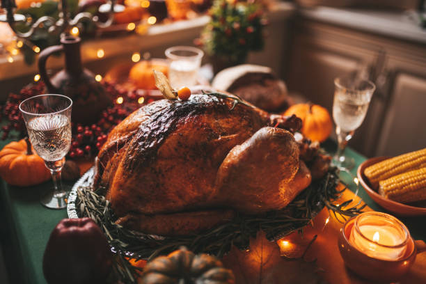 istock Thanksgiving holiday dinner table setting with fall decoration and pumpkins 1434672636