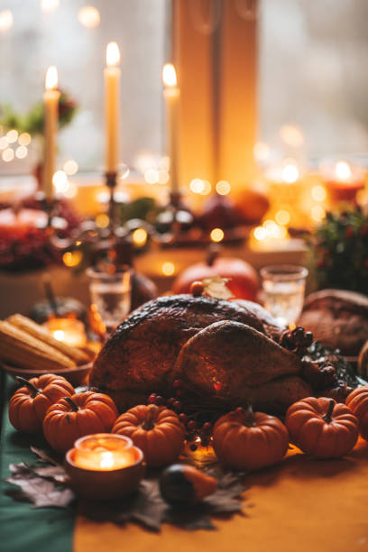 istock Thanksgiving holiday dinner table setting with fall decoration and pumpkins 1434672639