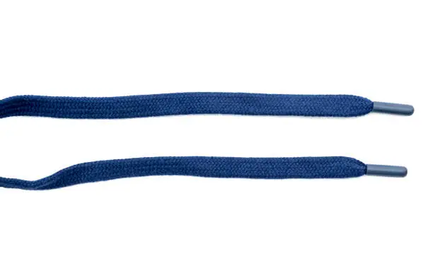 Photo of Close-up of two new blue sport laces or shoelaces isolated on white, top view