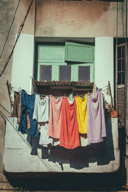 Havana Apartment Building\nBalcony with washed clothes drying in the air