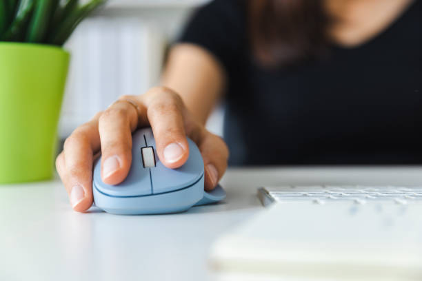 istock Close up of woman holding a computer mouse. 1434683781