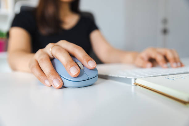 istock Close up of woman holding a computer mouse. 1434683789