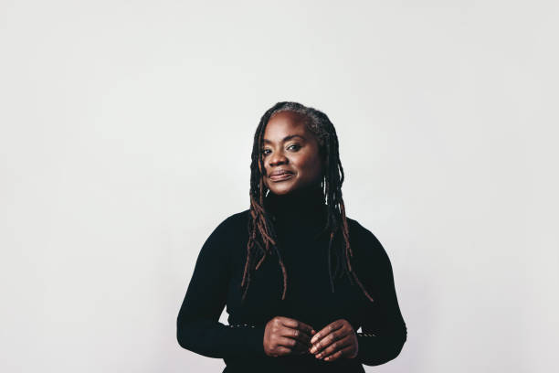 istock Confident woman with dreadlocks looking at the camera in a studio 1434685488