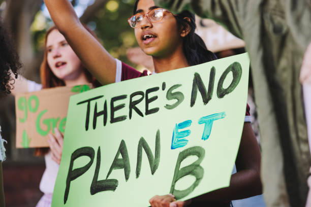 istock Teenage activists standing up against global warming 1434686030