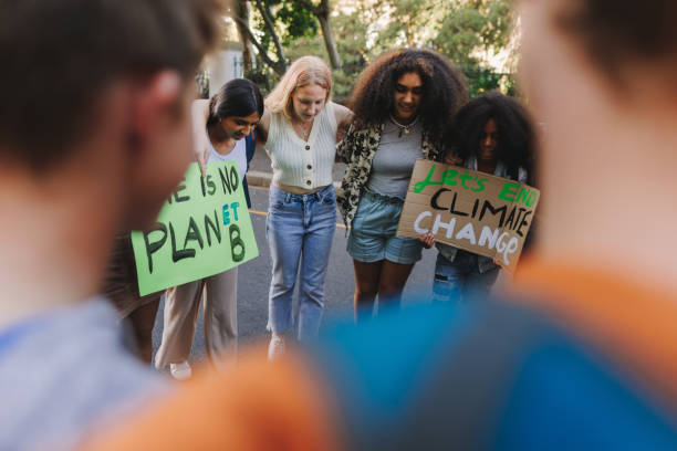 istock Multiethnic young people demonstrating against climate change 1434686087