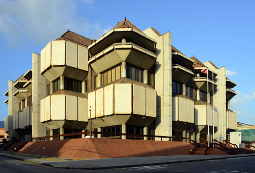 Port of Spain, Trinidad island, Trinidad and Tobago: Hall of Justice, the Judiciary of the Republic of Trinidad and Tobago, TT law courts - houses the Court of Appeal, the Civil and Criminal Divisions of the High Court in Port of Spain and the Tax Appeal Board. The Main Court Hall comprises all 16 main courts of the High Court - Brutalist building with sharp balconies and angular turrets - Knox Street.