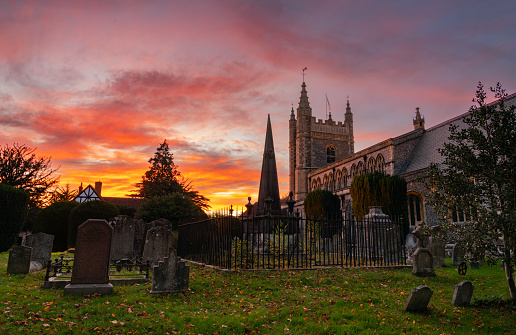 An Autumnal sunset at the Church of St Mary and All Saints in Beaconsfield, Buckinghamshire.