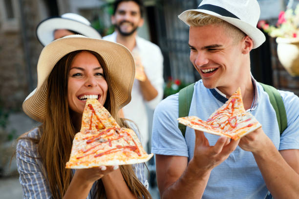 istock Couple eating pizza while traveling on vacation 1434688422
