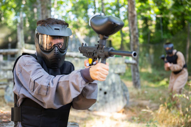 istock Woman targeting and shooting with paintball gun 1434690214