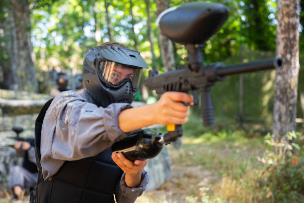 istock Paintball player recklessly aims with a gun on battlefield 1434690216