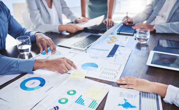 istock Teamwork, collaboration and infographic paper in business meeting for target audience data, KPI or demographic chart survey. Hands, digital marketing technology or employee with growth research idea 1434690877