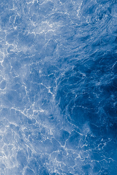 istock Blue purple sea surface with waves, splash and bubbles 1434696604