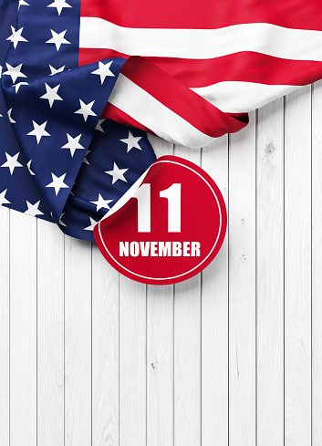 Veterans day concept American flag November 11 sticker  on white wood background vertical composition
