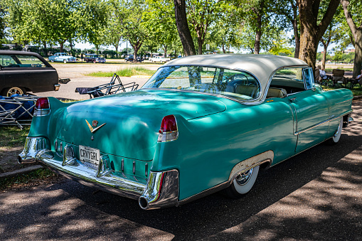 Falcon Heights, MN - June 19, 2022: High perspective rear corner view of a 1955 Cadillac Series 62 Hardtop Coupe at a local car show.