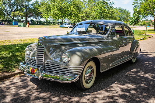 Falcon Heights, MN - June 19, 2022: High perspective front corner view of a 1947 Packard 2106 Custom Super Clipper Club Sedan at a local car show.