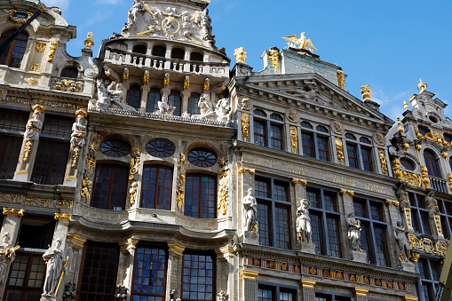 Brussels, Belgium - September 16, 2022: Upper part of houses on the Grand Place Le Cornet, House of the Corporation of Boatmen and La Louve, House of the Oath of Archers and two others on the sides