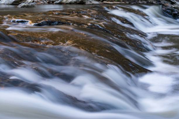 istock Low exposure of water flowing over the rocks. 1434706142