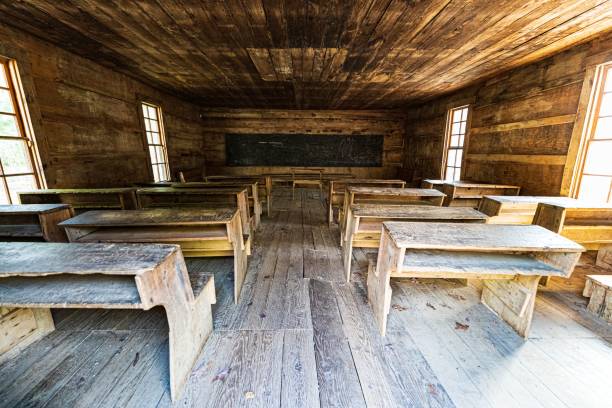 istock Old wooden classroom with a blackboard and desks. 1434706144