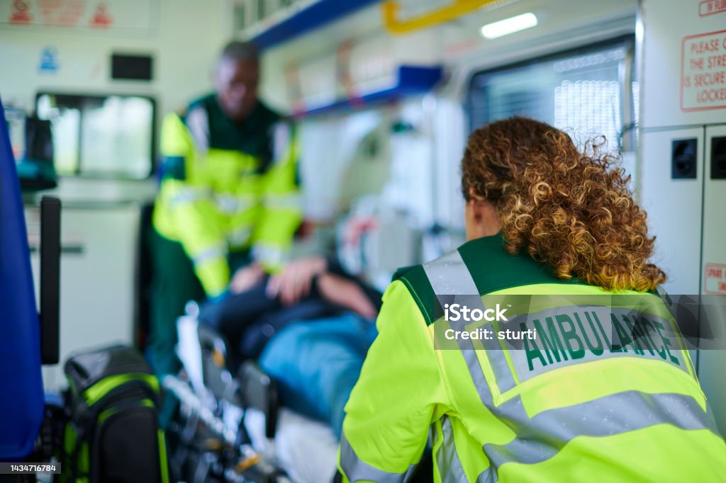 ambulance crew preparing casualty ambulance paramedic portrait Ambulance Stock Photo