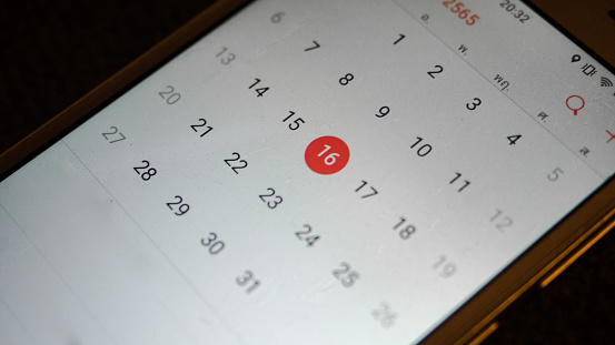 The organization smartphone close up may plan a reminder.