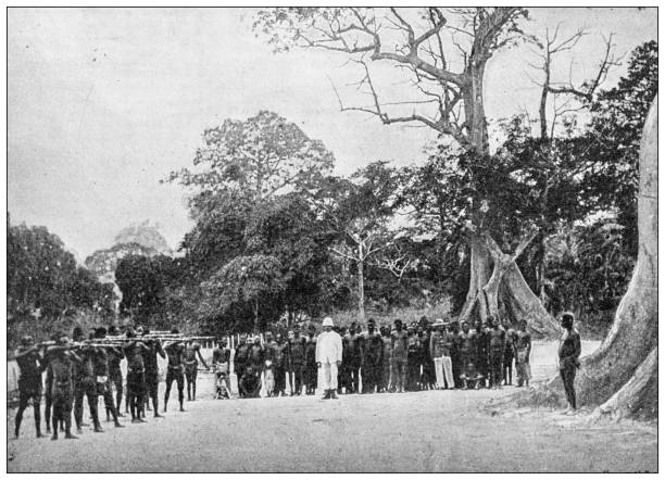 Antique image: French mission exploring Africa, Execution of Monounabéka, murderer of Louettière Antique image: French mission exploring Africa, Execution of Monounabéka, murderer of Louettière firing squad stock illustrations