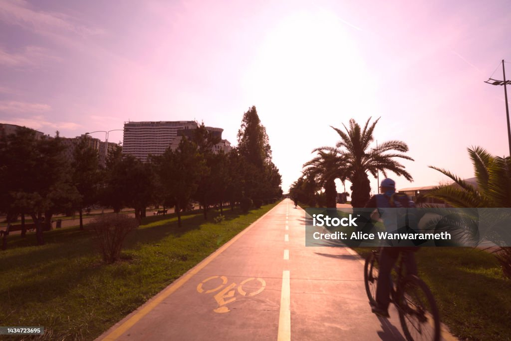 Bicycle lane through sunset at Batumi City Adjara Georgia 16 October 2022 Active Lifestyle Stock Photo