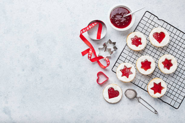istock Classic Linzer Christmas Cookies with raspberry or strawberry jam on light background. 1434725930