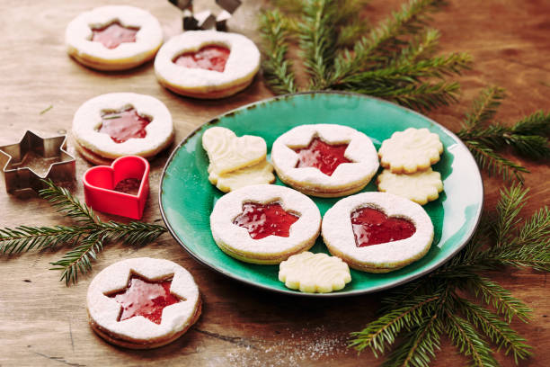 istock Classic Linzer Christmas Cookies with raspberry or strawberry jam on wooden table 1434726158