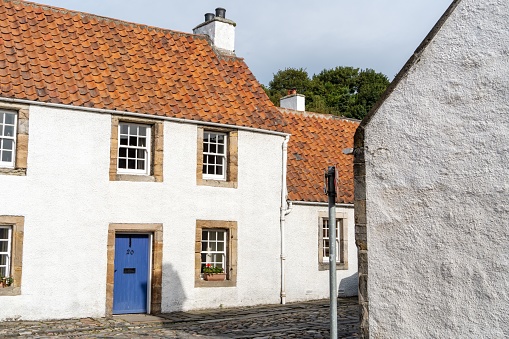 Culross, United Kingdom – September 17, 2022: A white quaint house in picturesque village of Culross, Scotland, UK - Outlander TV series location