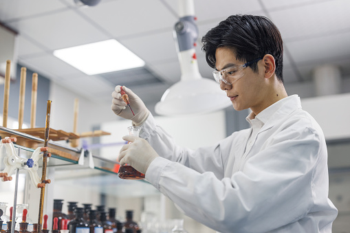 glass cylinder and test tube science equipment in blue information research lab background