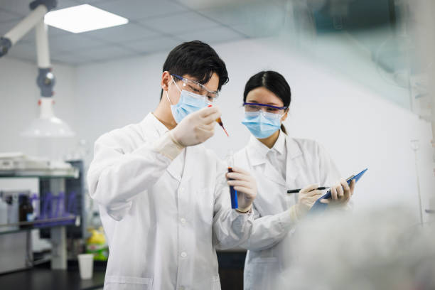 istock asian scientists are working at chemical lab. 1434729816