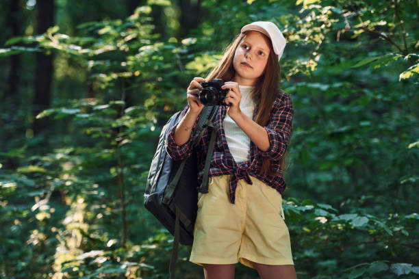 istock Girl is in the forest at summer day time discovering new places 1434732414