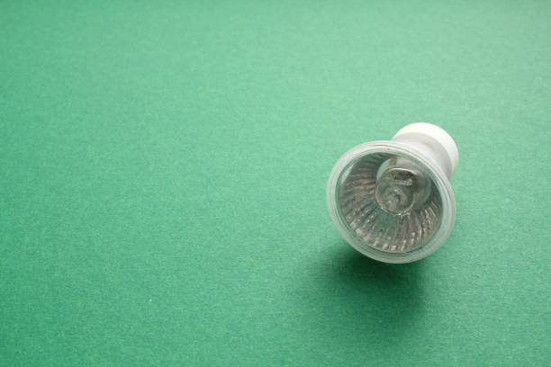 istock Electric LED light bulb lamp on green background with copy space. Eco saving power and environmental conservation energy efficiency concep 1434733266
