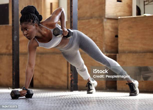 Strong Woman Doing Fitness Training For Exercise At Gym Weights For Cardio Workout And Motivation For Lifestyle And Healthy Body African Athlete Doing Sports On Floor With Equipment For Wellness Stock Photo - Download Image Now