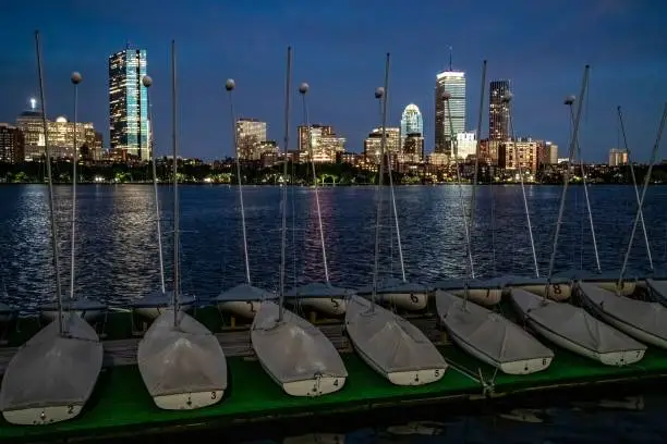 Photo of Boston skyline from the MIT sailing pavilion in the evening.