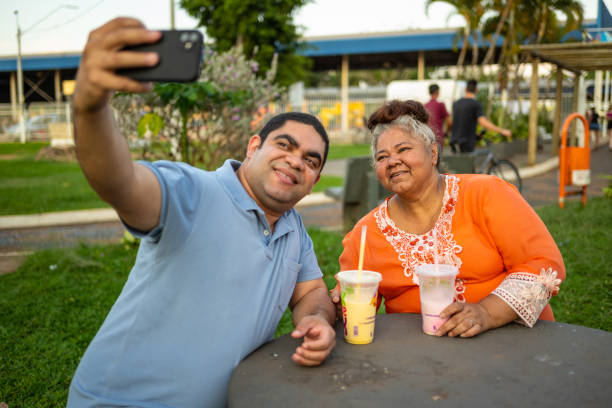 istock Latin couple having Milkshake at the park 1434735625
