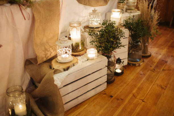 istock Boho wedding decoration. Rustic decorations of wedding venue. Romantic atmosphere. Wooden box and white candles. 1434735646