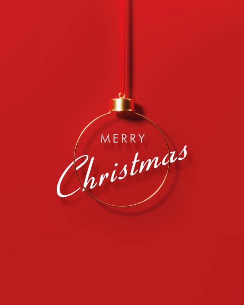 istock Merry Christmas Message Siting Behind Gold Colored Bauble On Red Background 1434735700