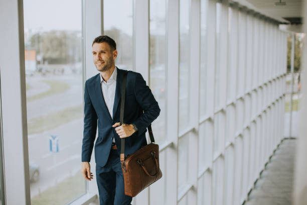 istock Young business executive with briefcase going up the stairs 1434737689