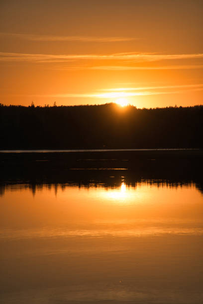 istock Sunset with reflection on a Swedish lake in Smalland. Romantic evening mood 1434737756
