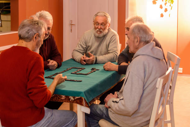 istock A small group of older people is playing dominoes. 1434740298