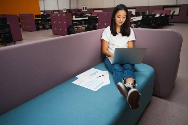 istock Charming female looking to the screen of computer in the modern workplace 1434741292