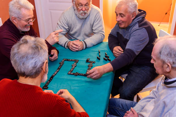 istock Active seniors are enjoying a domino game at home. 1434741393